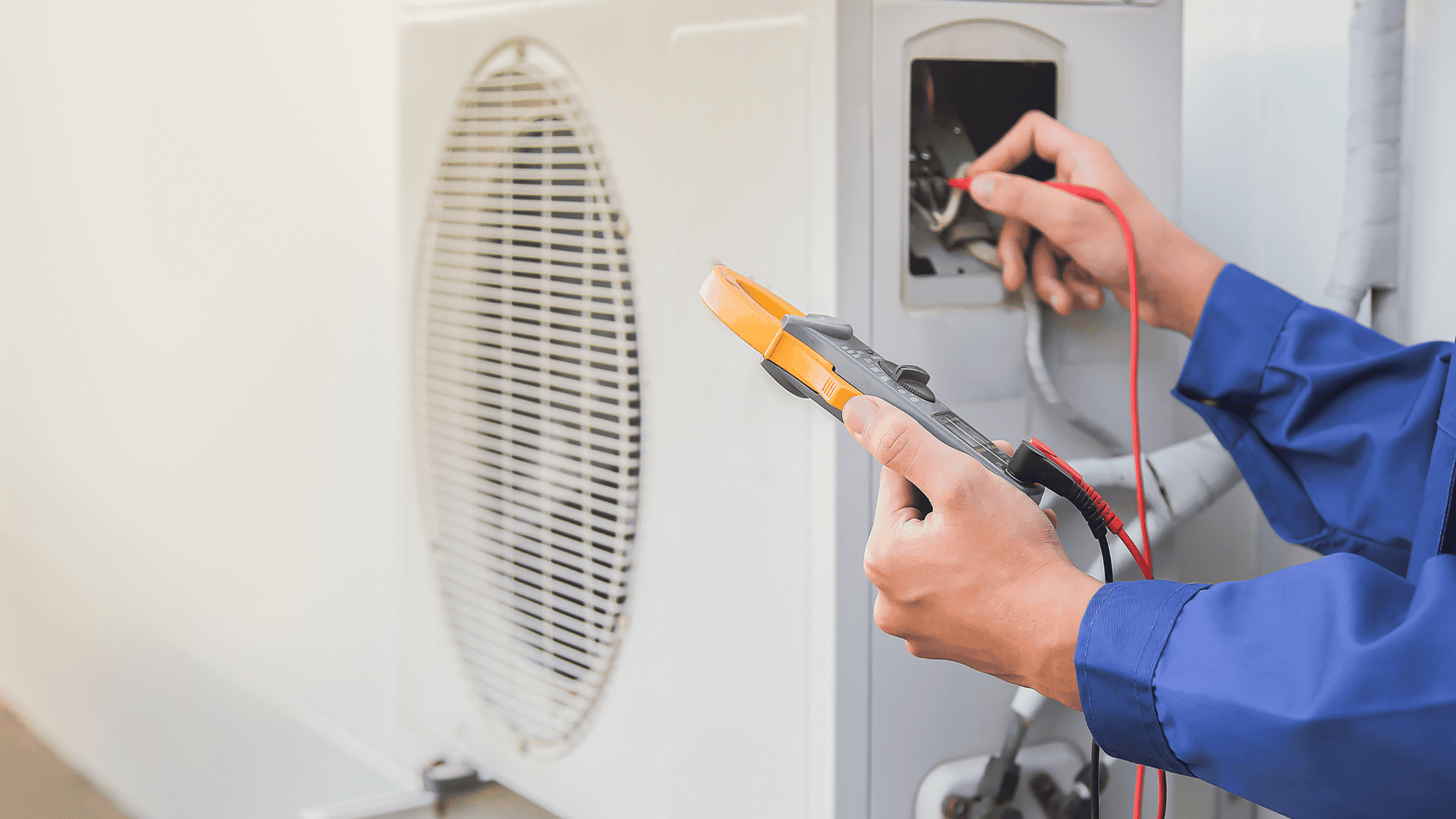 a person is working on an air conditioner